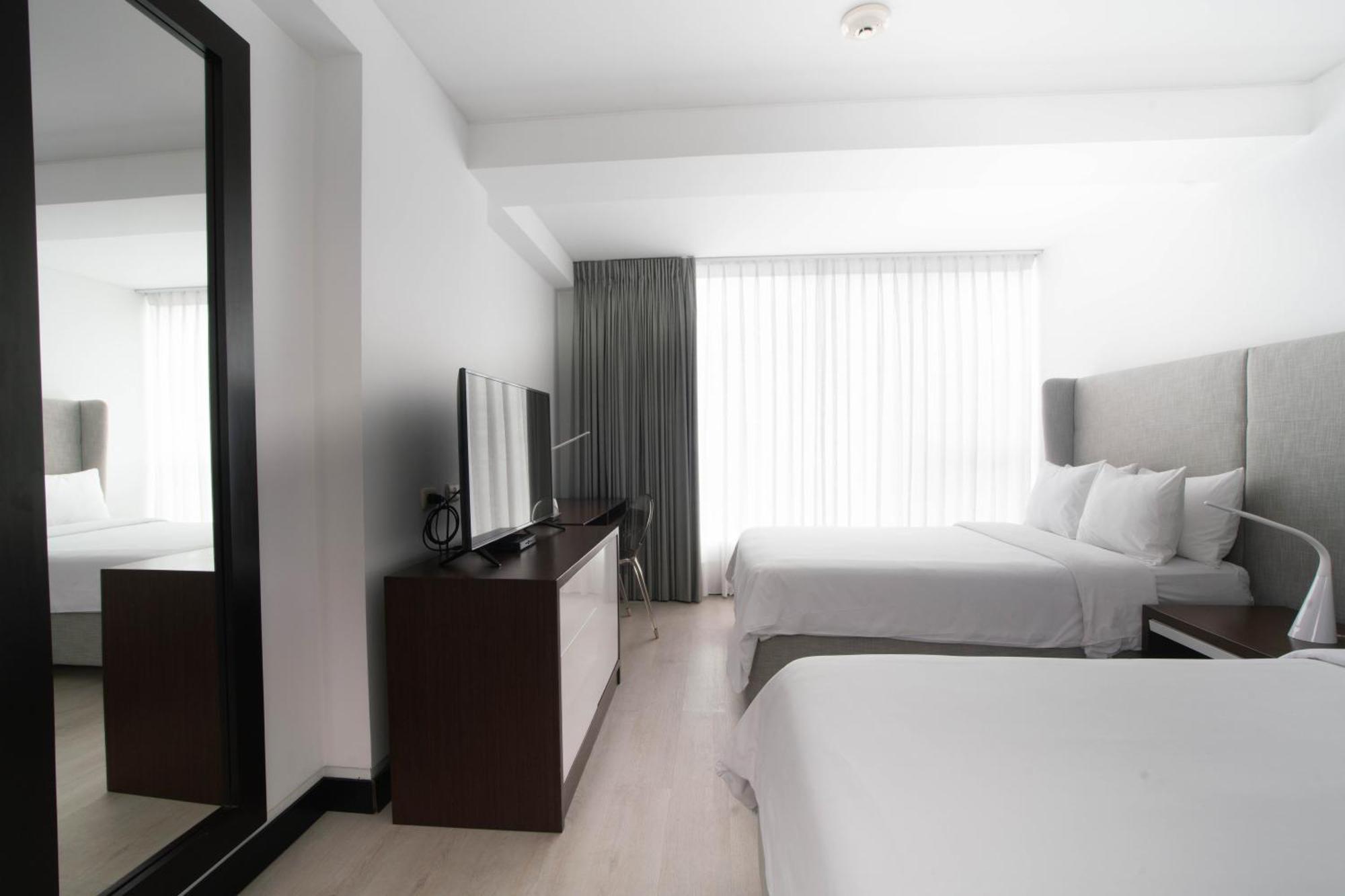 Quarto Duplo Premium com 2 Camas de Casal