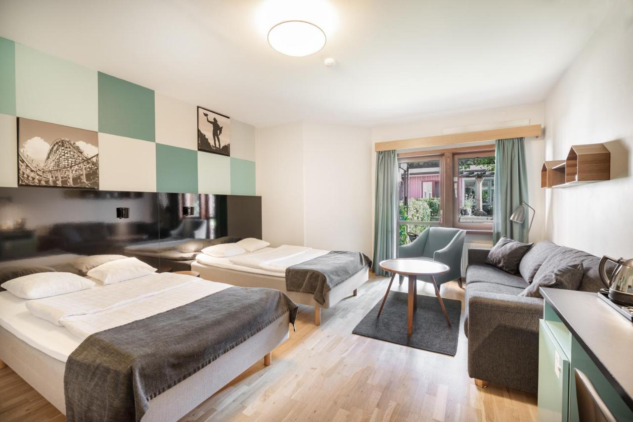 Habitación Doble Superior con 2 camas individuales y sofá cama