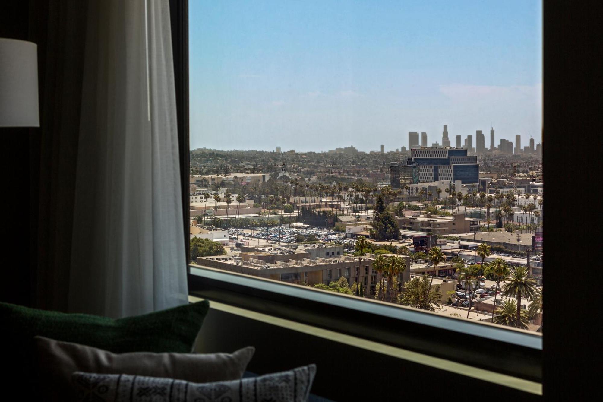 Essential Queen Room with Two Queen Beds and City View